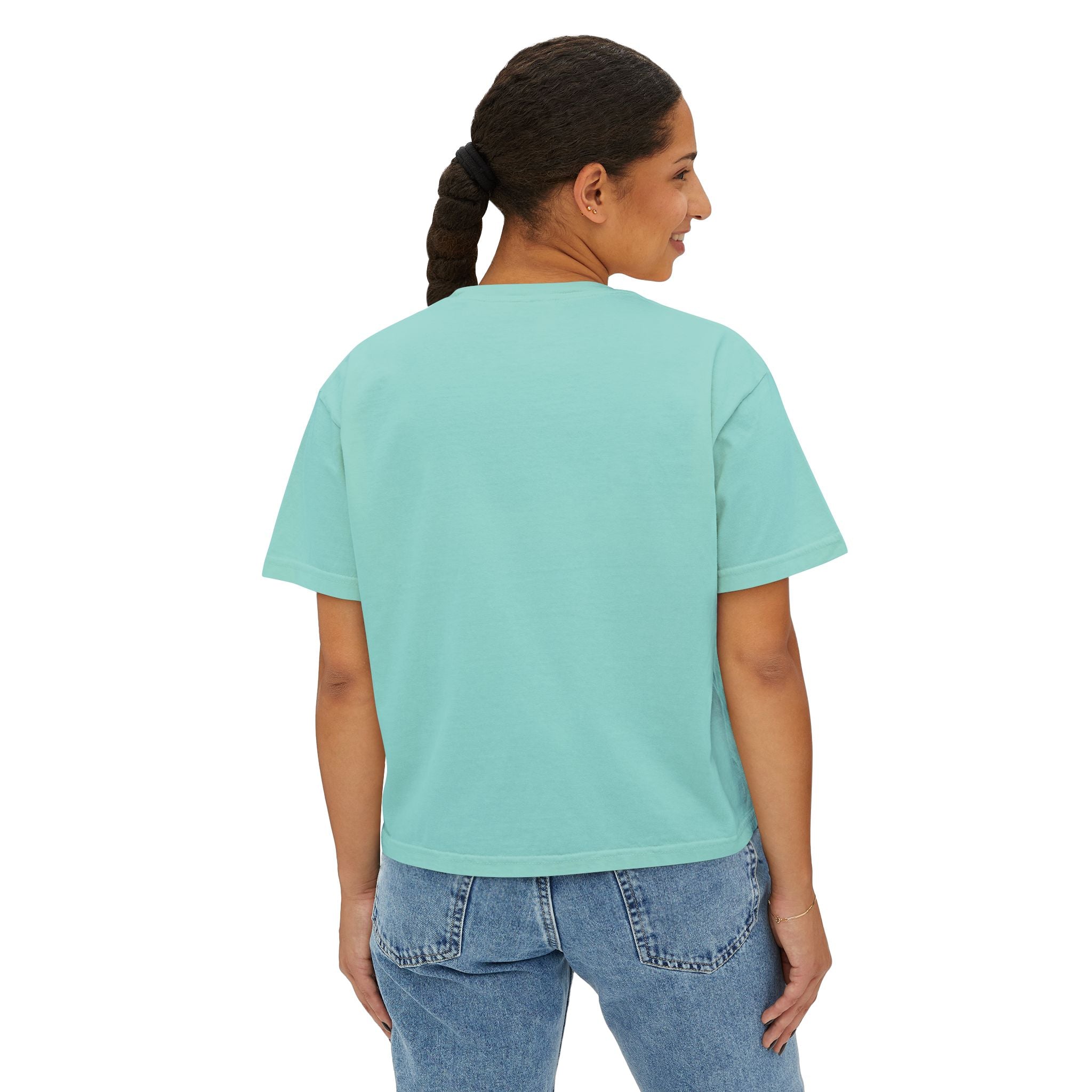 Mint green oversized t-shirt paired with blue jeans, showcasing streetwear style.