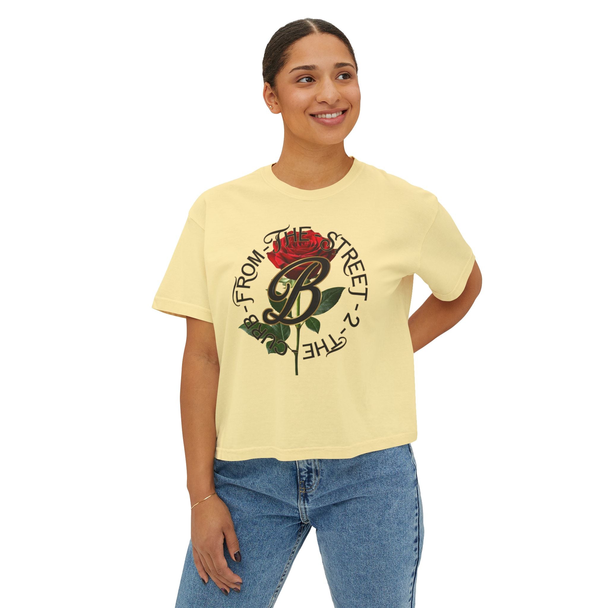 Yellow streetwear tee with red rose graphic and 'From The Street 2 The Curb' text, paired with jeans.