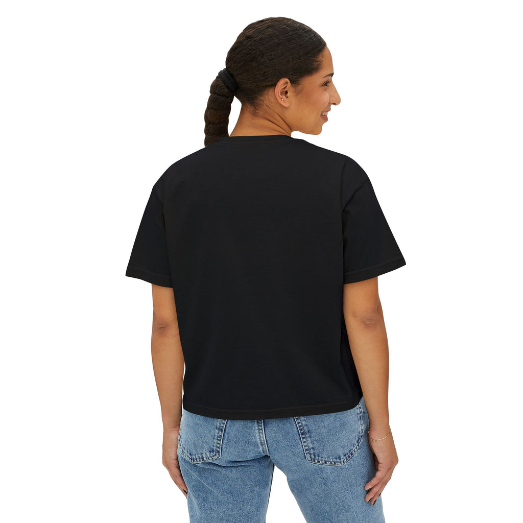 Black oversized graphic tee for women, streetwear style with relaxed fit, paired with blue jeans